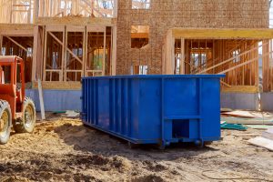 construction rubbish bin placed infront of developing house
